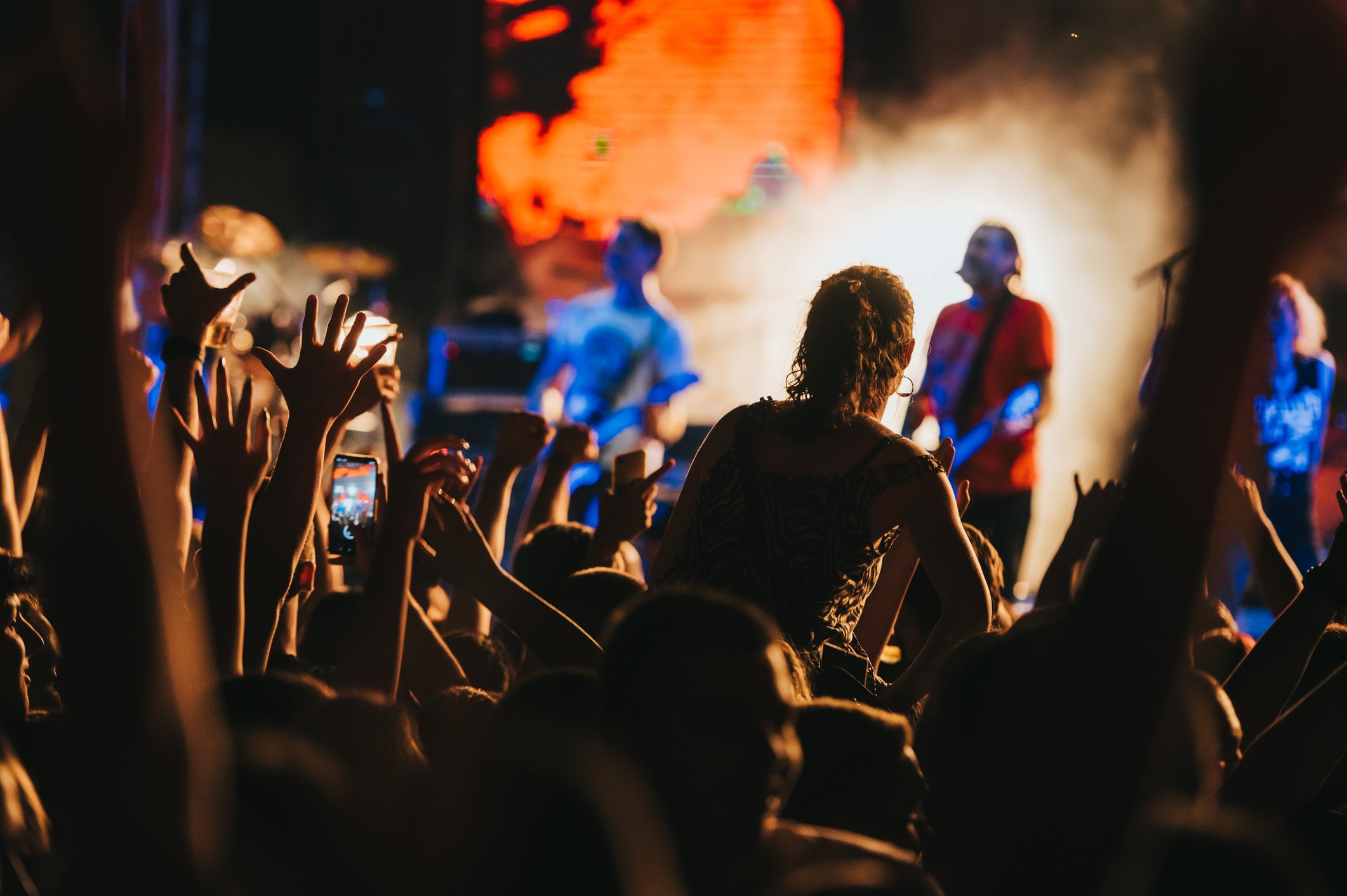 Audience watching a band playing onstage