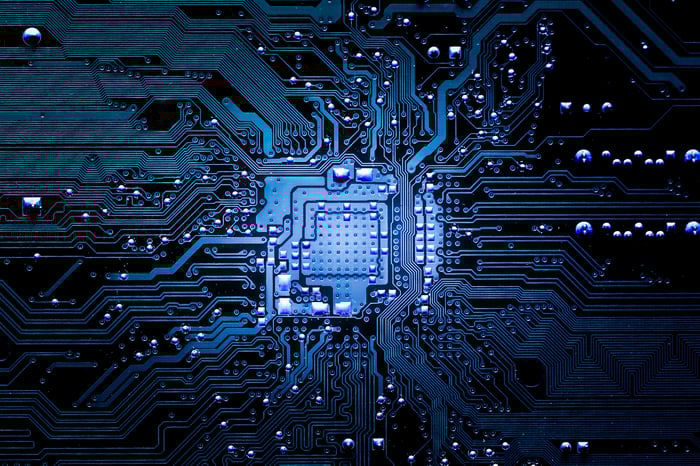 A microchip with blue luminescence flowing through it. 