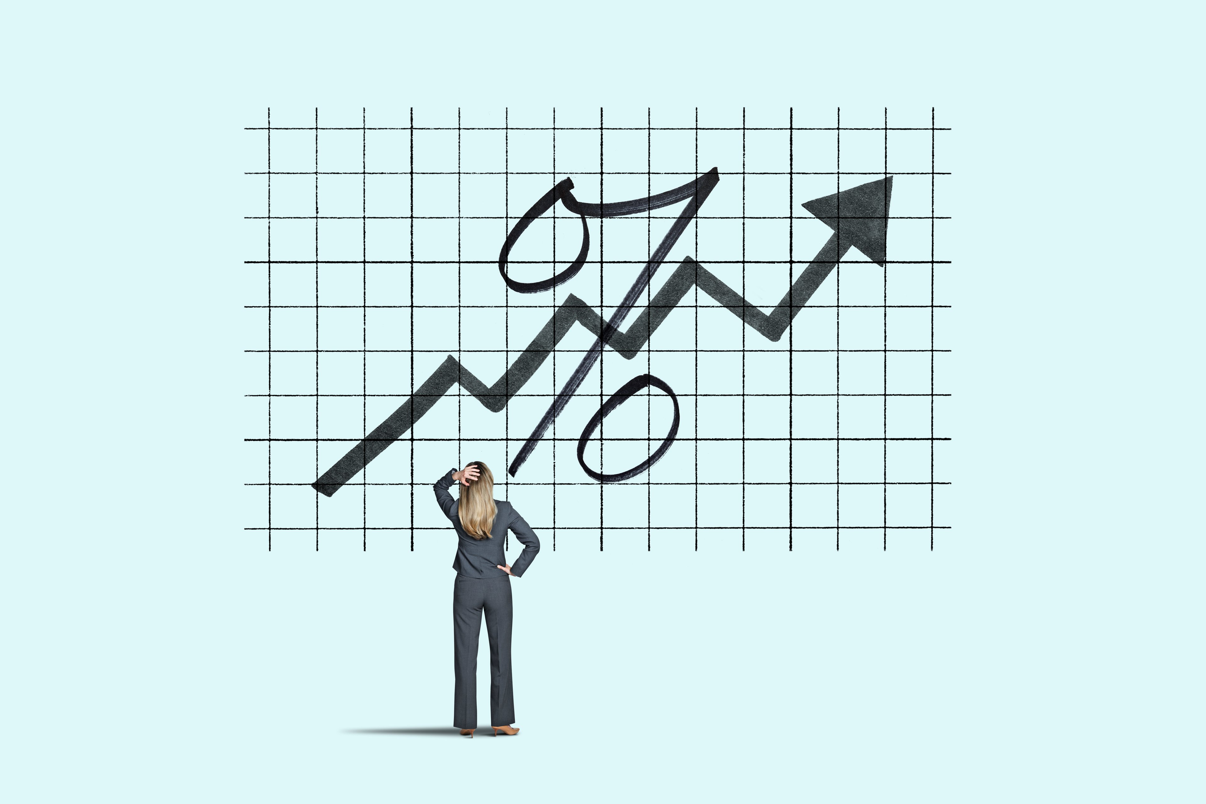 Investor looking at a rising rates chart --GettyImages-1344805543