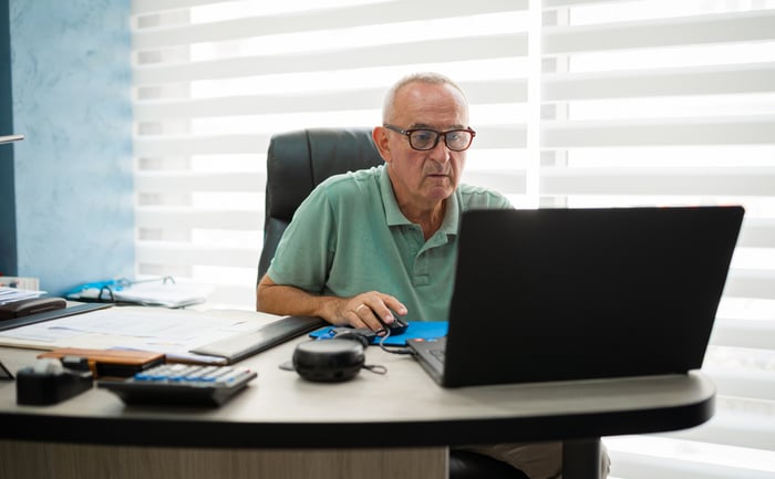 A person at a computer.