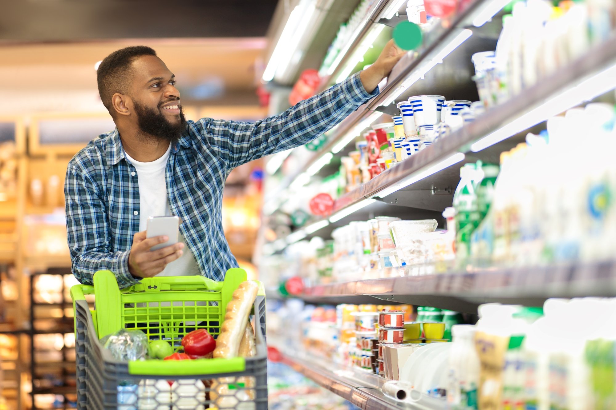 Person grocery shopping in a store.