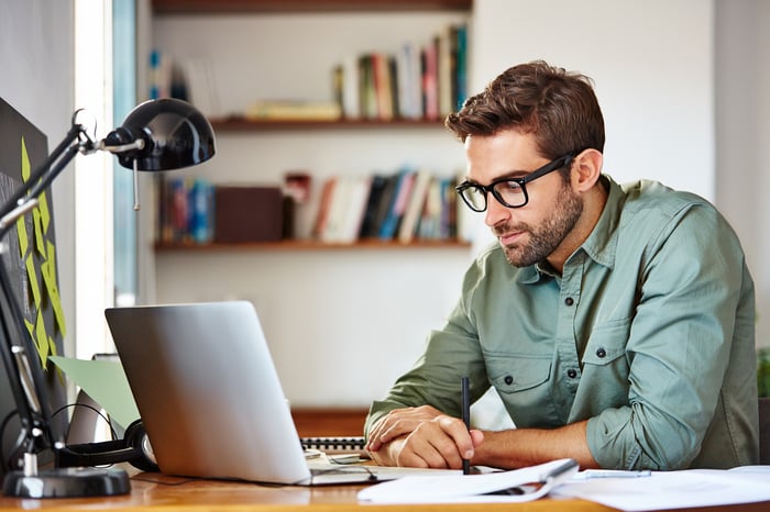 A person at a laptop.