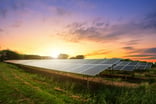 Solar panel on dramatic sunset sky background Getty