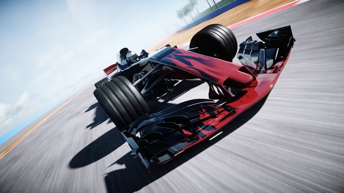 A close up shot of the front of a Formula 1 race car driving fast towards the camera.