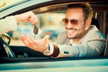 man taking car key auto loan lease