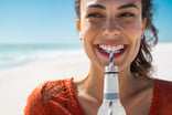 drinking soft drink on beach soda