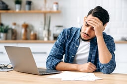 man 20s laptop stress GettyImages-1418580443