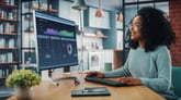 Businesswoman_analyzing_market_data_charts_on_desktop