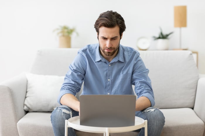 A person at a laptop.