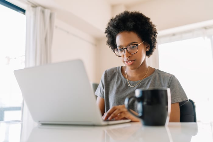 A person typing on a laptop.