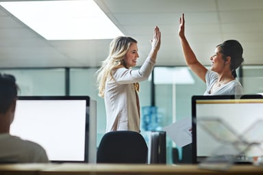 Getty - high five two people celebrate happy success victory winning