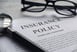 insurance policy and glasses