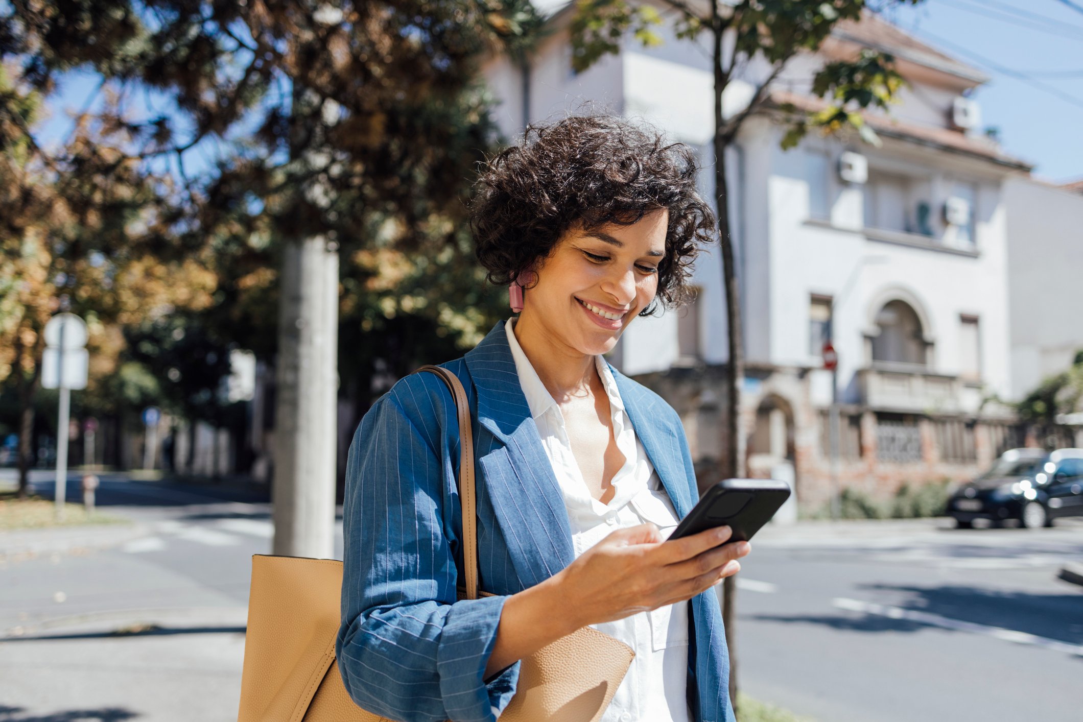Mobile Phone Used While Walking Outside-GettyImages-1357947512