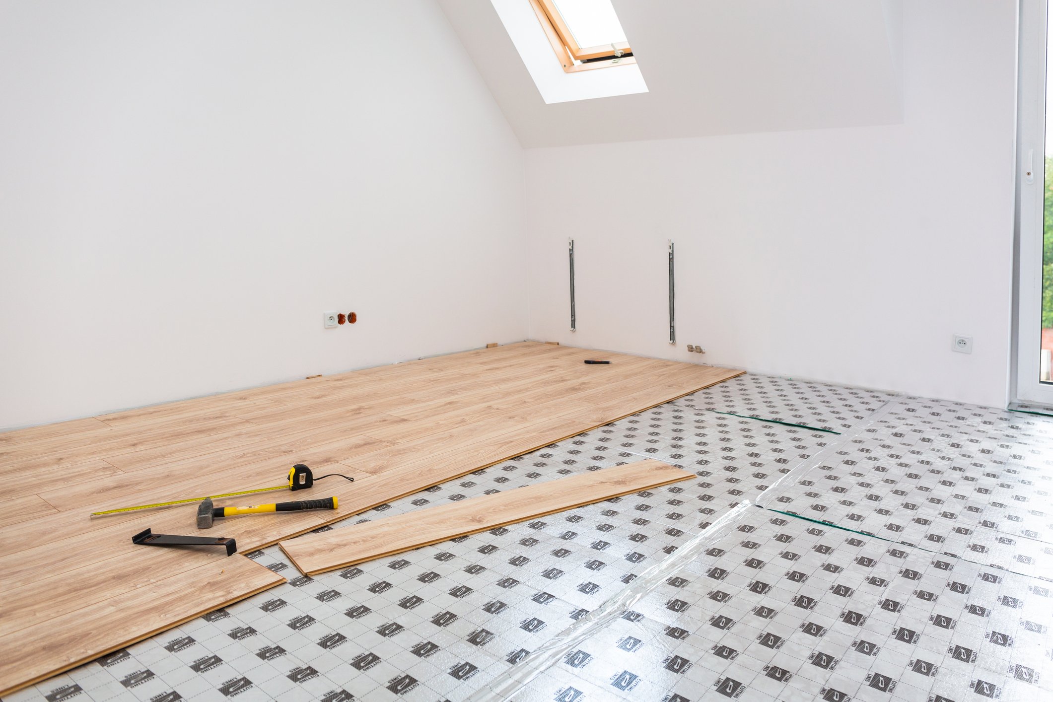 contractor construction Instalation of new wooden floor at home getty