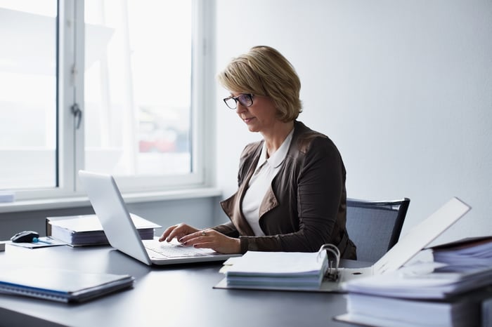 A person at a laptop.