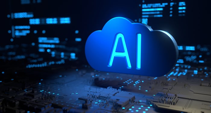 The letters AI emblazoned on a cloud symbol positioned above a circuit board.