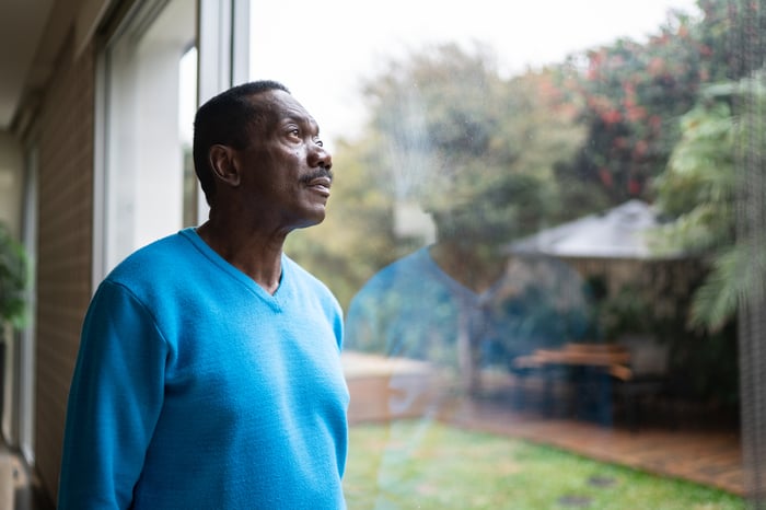 Person looking out a window.