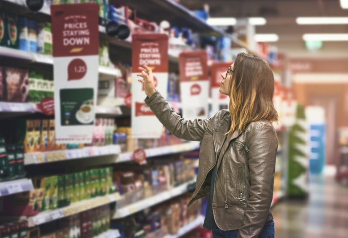 A person shopping at a grocery store.