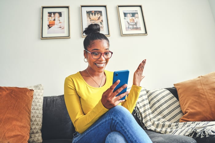 Surprised person looking at phone. 