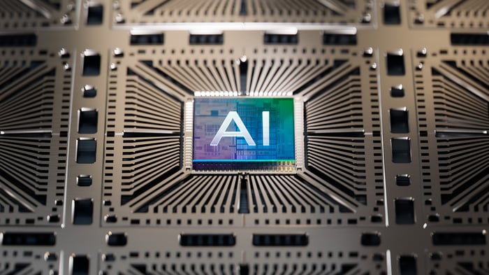 A computer chip embedded in a circuit board with the letters AI embossed on the top.