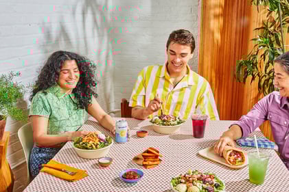 Cava lifestyle picture showing three diners at a restaurant