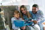 family trip on airplane reading to son-1200x800-5b2df79