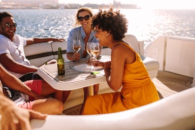 Getty Images happy friends wine boat fun wealth rich excited water ocean-1200x800-5b2df79