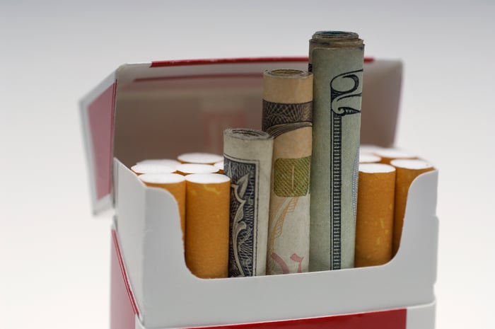 Money rolled up and put inside a cigarette box like cigarettes.