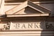 Sturdy masonry building reads BANK.