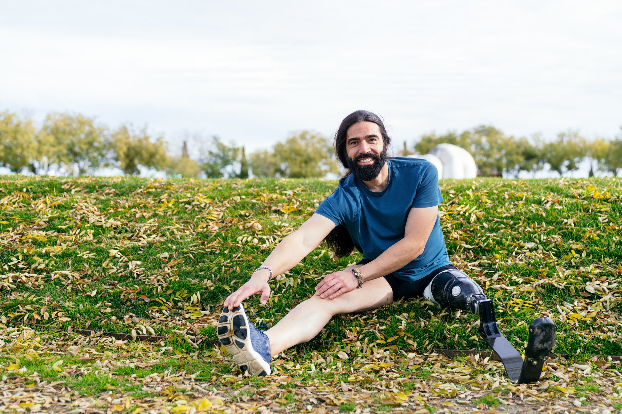 Getty - exercising outdoors stretching smiling happy