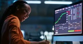 Person smiling looking at a stock screener