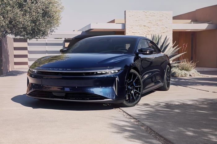 A blue Lucid Air Sapphire, a high-performance electric luxury sedan.