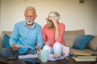 Senior couple stressed bills GettyImages-1074329036
