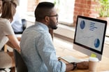 Businessman_working_on_a_desktop