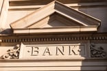 Sturdy masonry building reads BANK.