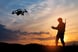Person flying a drone at dusk or twilight
