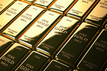 Stacks of gold bars marked FINE GOLD 1000g.