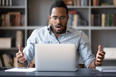 22_01_26 A person looking at a computer screen with a look of unpleasant surprise _GettyImages-1216968860