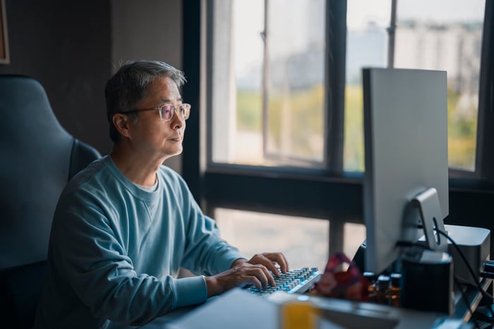 A person at a computer.