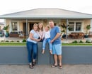 Family in front of a house