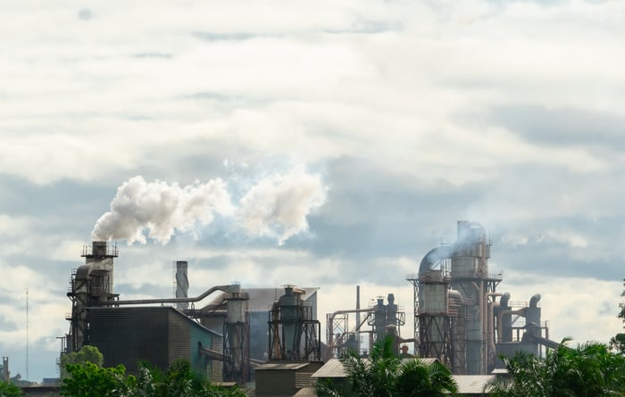 Emissions coming from large industrial chimneys.