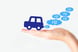 Hand holds out a fuel cell car  utting out H2 bubbles as exhaust.