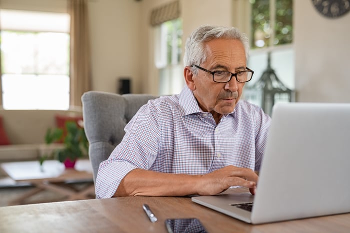 A person at a laptop.