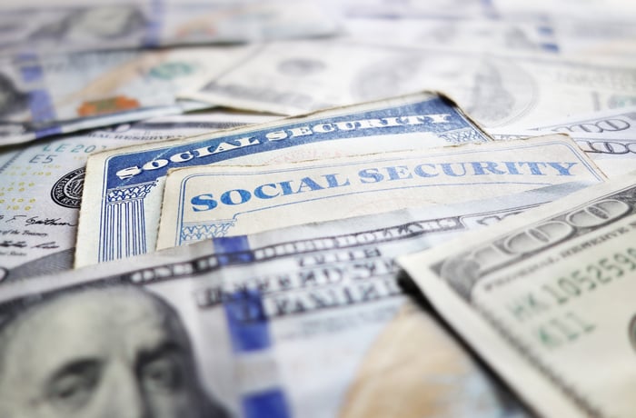 Social Security cards among hundred dollar bills.