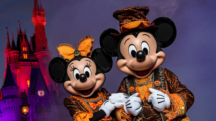 Mickey and Minnie Mouse dressed up for a Halloween-themed event at Disney World's Magic Kingdom.