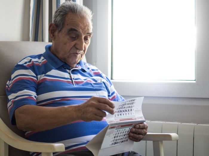 A person looking at a calendar.