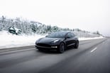 TSLA Model 3 Driving Down Wintery Road