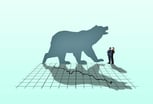 Bear silhouette against a stock market downturn chart