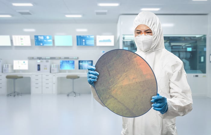 An engineer in a chip manufacturing facility. 