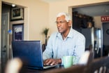 Senior man laptop GettyImages-935722790
